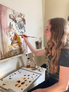 Alysa Brown painting in her studio